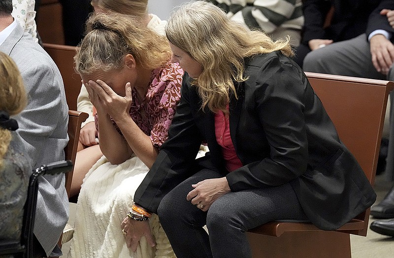 Debra Hixon (right) tries to console her sister-in-law, Natalie Hixon, as they hear that Nikolas Cruz would be spared the death penalty during court Thursday in Fort Lauderdale, Fla. Christopher Hixon, Debra’s husband and Natalie’s brother, was one of the 17 victims in the 2018 shootings. More photos at arkansasonline.com/1014broward/.
(AP/South Florida Sun Sentinel/Amy Beth Bennett)