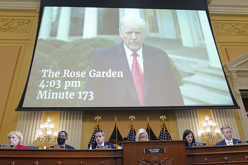 FILE - A video of President Donald Trump recording a statement in the Rose Garden of the White House on Jan. 6 is played as the House select committee investigating the Jan. 6 attack on the U.S. Capitol holds a hearing at the Capitol in Washington on July 21, 2022. (AP/Patrick Semansky, File)