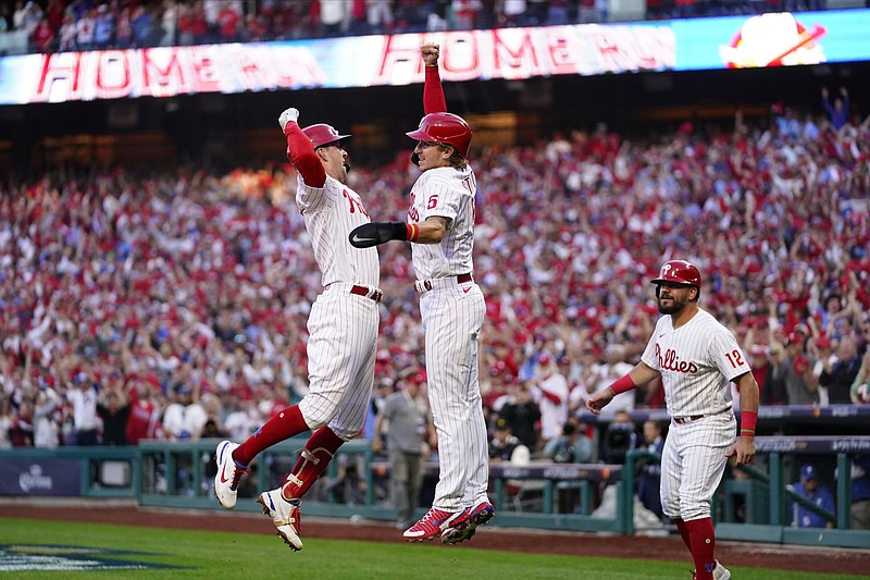 Rhys Hoskins (left) of the Philadelphia Phillies celebrates his threerun home run with Bryson Stott during the third inning of Game 3 of their National League division series against the Atlanta Braves on Friday in Philadelphia. Hoskins’ homer put the Phillies ahead 4-0 en route to a 9-1 victory that gave them a 2-1 series advantage.
(AP/Matt Slocum)