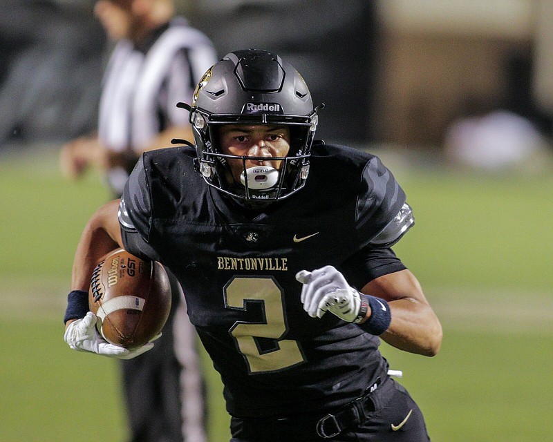 Bentonville junior CJ Brown runs to the end zone for a touchdown Friday during the Tigers’ 31-30 overtime victory over the Fayetteville Bulldogs at Tiger Stadium in Bentonville.
(Special to the NWA Democrat-Gazette/Brent Soule)