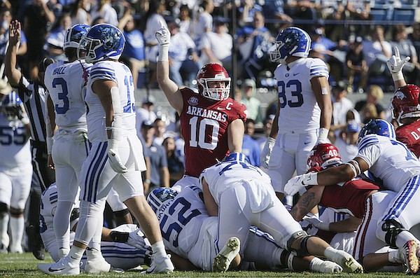 Arkansas linebacker Bumper Pool (10) signals the Razorbacks have the ball following a fumble during the second quarter of a game against BYU on Saturday, Oct. 15, 2022, in Provo, Utah.