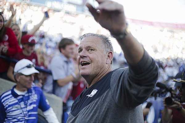 Arkansas coach Sam Pittman waves to fans following a 52-35 victory over BYU on Saturday, Oct. 15, 2022, in Provo, Utah.