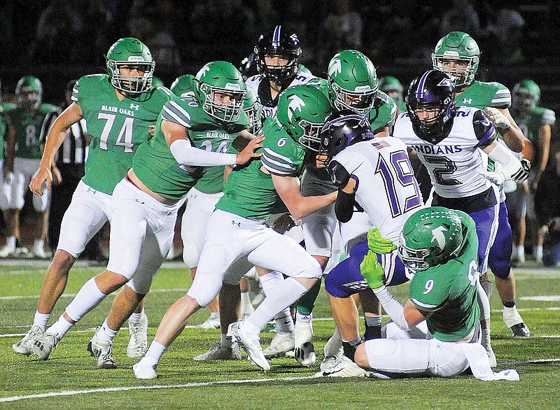 Blair Oaks Junior Falcon cheerleaders share football spirit