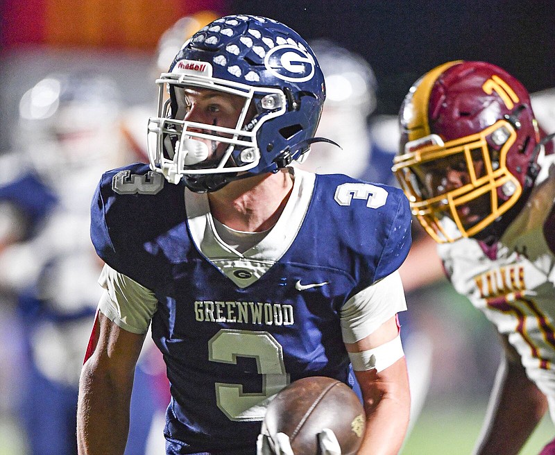 Greenwood wide receiver Grant Karnes eludes a defender, Friday, Oct. 14, 2022. (NWA Democrat-Gazette/Hank Layton)