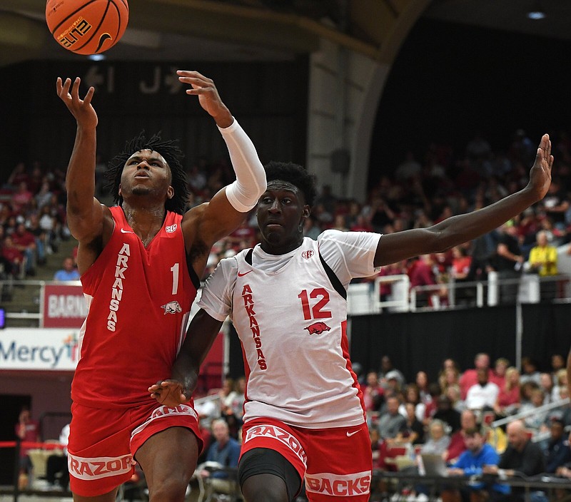 Ricky Council IV attempts a layup while Barry Dunning JR. defends Sunday Oct. 16, 2022 during the annual Razorback Red-White basketball game at Barnhill Arena in Fayetteville.   Visit nwaonline.com/221017Daily/ for today's photo gallery.  (NWA Democrat-Gazette/J.T. Wampler).