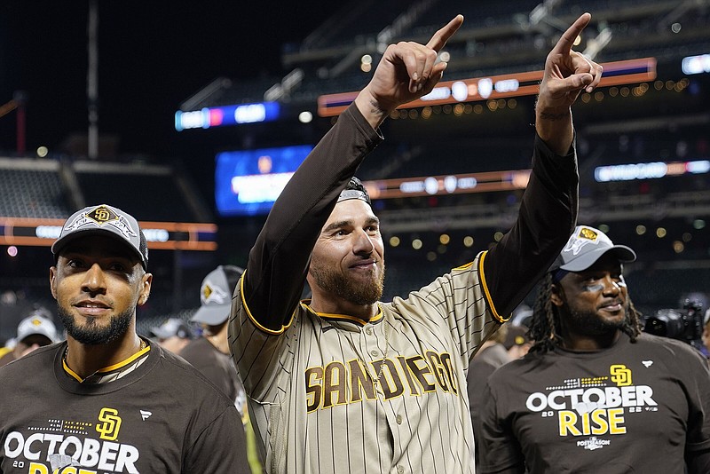 San Diego pitcher Joe Musgrove (middle), who starts for the Padres today in Game 3 of the National League Championship Series, said he’s mentally more prepared to handle the pressure of the postseason than in 2017 when he pitched for the Houston Astros. “I’ve got a way better understanding of myself and how things work,” Musgrove said. “Certain triggers that I have, and what it is that really gets to me and being able to have some awareness of what those things are before I got into a moment like this.”
(AP/John Minchillo)