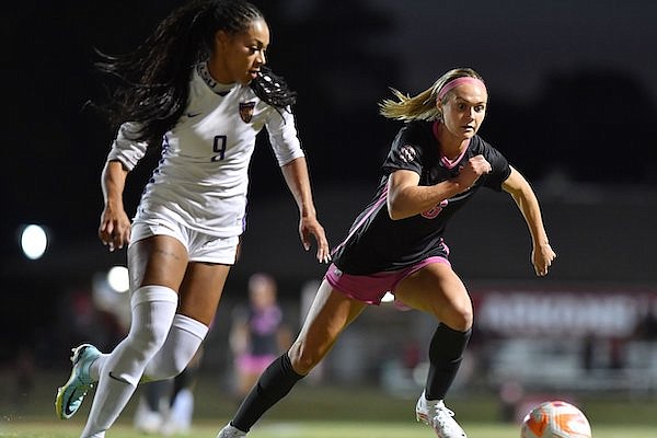 Arkansas' Anna Podojil (16) vies for the ball Thursday, Oct. 20, 2022, with LSU's Maya Gordon (9) during the first half of play at Razorback Field in Fayetteville.