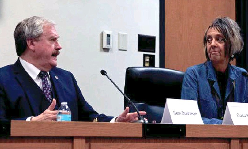 Sam Bushman, left, and Carla Steck exchange comments Wednesday, Oct. 19, 2022, during a forum for Cole County presiding commissioner candidates at Jefferson City Hall. (Kate Cassady/News Tribune photo)