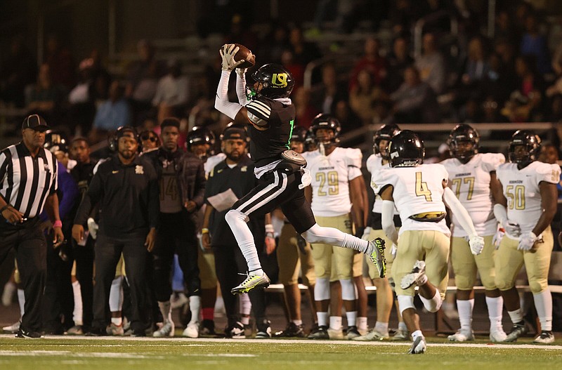 Anton Pierce makes a leaping catch for Mills during a home game against Joe T. Robinson on Friday, Oct. 21, 2022.