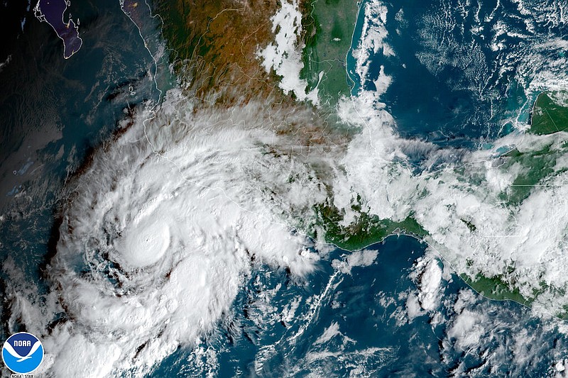 This satellite image taken at 10am ET and provided by NOAA shows Tropical Storm Roslyn approaching the Pacific coast of Mexico, Friday, Oct. 21, 2022. (NOAA via AP)