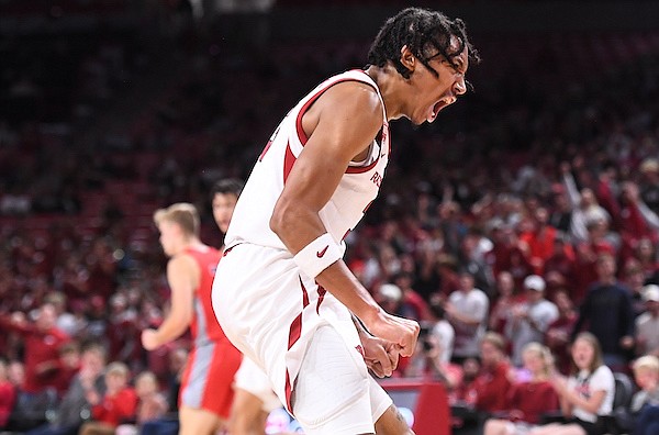 Arkansas guard Nick Smith celebrates during an exhibition game against Rogers State on Monday, Oct. 24, 2022, in Fayetteville.