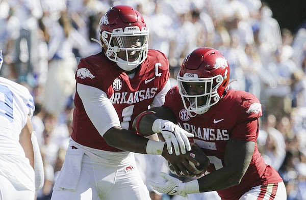 Arkansas quarterback KJ Jefferson (1) hands the ball off to running back Raheim Sanders (5), Saturday, October 15, 2022 during the second quarter of a football game at LaVell Edwards Stadium in Provo, Utah.