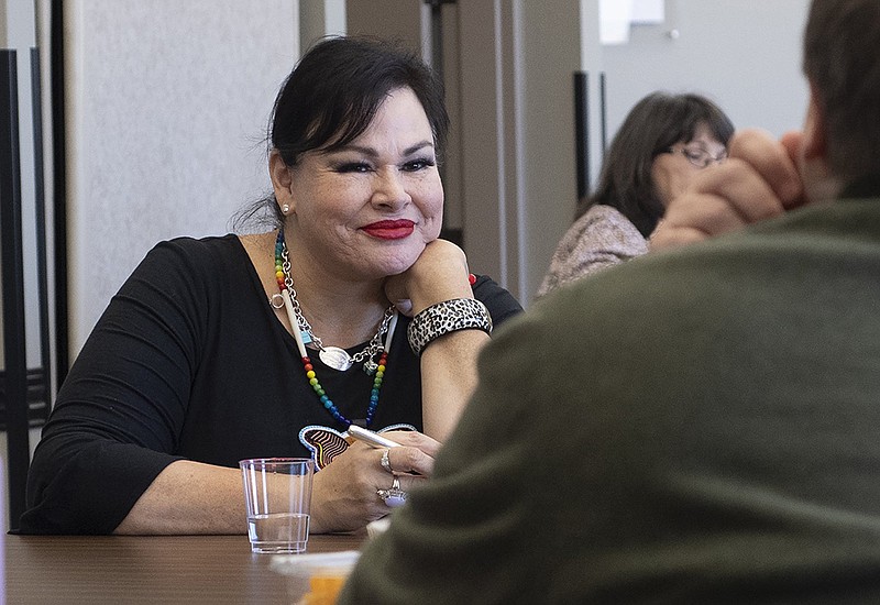 Author Angeline Boulley visits with readers Thursday in Fayetteville before a panel discussion with Boulley and local indigenous authors and artists.
(NWA Democrat-Gazette/J.T. Wampler)