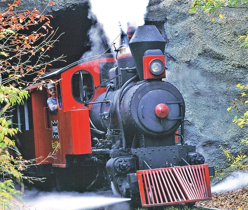 COURTESY PHOTO: The locomotive pulling the Silver Dollar Line blows steam as it exits the tunnel at Silver Dollar City. The park boasts three historic steam engines to carry guests back to the Ozarks in the 1880s.