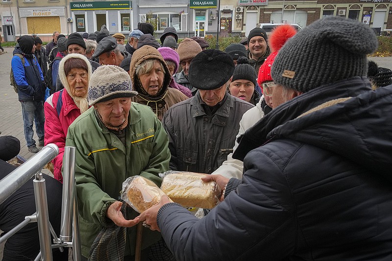 People line up for free bread from volunteers Friday in Bakhmut in eastern Ukraine. The city has seen some of the heaviest fighting of the war this week as Russian forces continue a heavy assault without gaining significant ground.
(AP/Efrem Lukatsky)