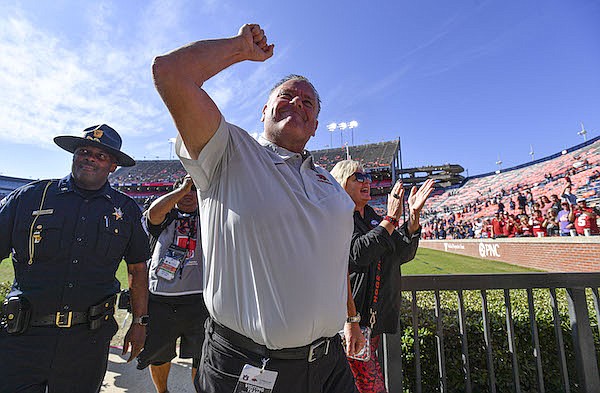 Arkansas coach Sam Pittman motions to fans as he leaves the field following a 41-27 victory over Auburn on Saturday, Oct. 29, 2022, in Auburn, Ala.