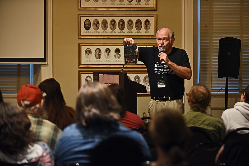 Author Pat Fitzhugh talks about one of his books Saturday during the Arkansas Paranormal Expo at the MacArthur Museum of Arkansas Military History in Little Rock. More photos at arkansasonline.com/1030paranormal.
(Arkansas Democrat-Gazette/Staci Vandagriff)