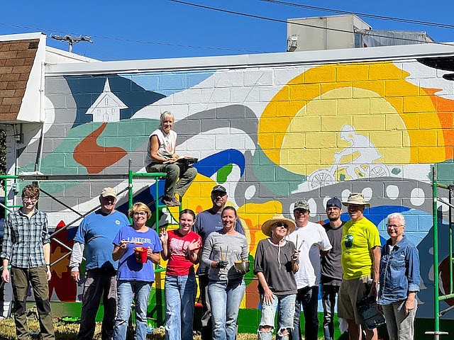 Keep Soddy-Daisy Beautiful / Artist Mary Tomas (center) and a group of more than 20 volunteer painters celebrate the completion of the new mural commissioned by Keep Soddy-Daisy Beautiful.