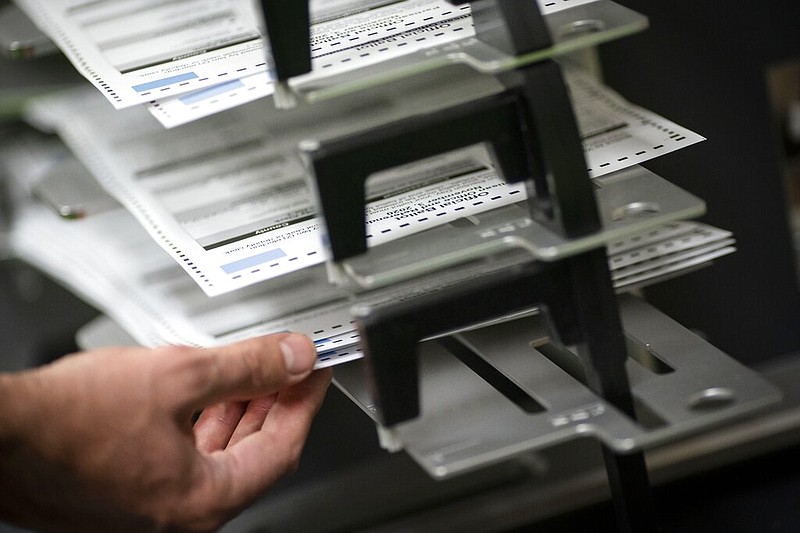 Poll workers sort out early and absentee Wisconsin ballots at the Kenosha Municipal building in Kenosha, Wis., on Election Day in this Nov. 3, 2020 file photo. (AP/Wong Maye-E)