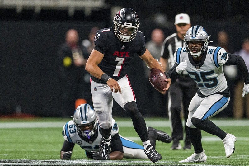 Atlanta Falcons quarterback Marcus Mariota (1) runs the ball during overtime of an NFL football game against the Carolina Panthers, Sunday, Oct. 30, 2022, in Atlanta. The Atlanta Falcons won 37-34. (AP Photo/Danny Karnik)