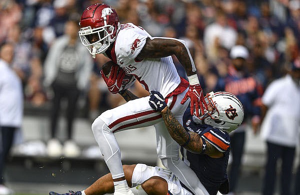 Arkansas wide receiver Matt Landers (3) is tackled by Auburn safety Donovan Kaufman (1), Saturday, Oct. 29, 2022, during the second quarter of the Razorbacks’ 41-27 win over the Tigers at Jordan-Hare Stadium in Auburn, Ala. Visit nwaonline.com/221030Daily/ for the photo gallery.
