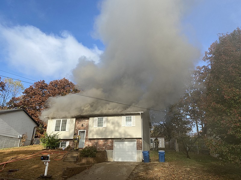 Jefferson City firefighters responded around 9:40 a.m. Monday, Oct. 31, 2022, to a fire at a residence in the 1800 block of Mississippi Street. (Julie Smith/News Tribune photo)