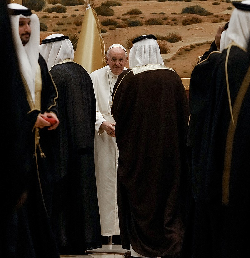 Officials greet Pope Francis as he arrives Thursday at Sakhir Air Base in Bahrain for a visit to the Sunni-led kingdom and its tiny Catholic community. Francis called on Bahrain authorities to ensure basic human rights for all citizens in light of rights groups’ accusations of systemic discrimination against its Shiite majority. The pope’s four-day stay will include a government-sponsored interfaith conference on East-West dialogue.
(AP/Alessandra Tarantino)