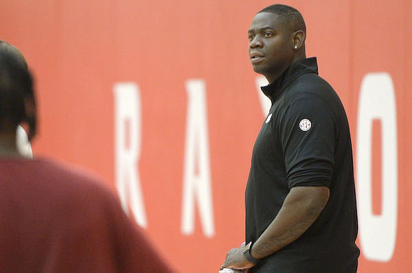 Former Arkansas guard and Razorbacks recruiting coordinator Ronnie Brewer watches practice on Tuesday, Sept. 28, 2021, in Fayetteville.