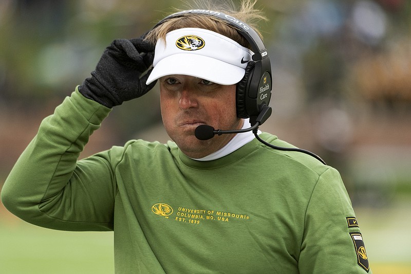 Missouri head coach Eli Drinkwitz walks to the sideline during the second quarter of Saturday's game against Kentucky at Faurot Field. (The Associated Press)