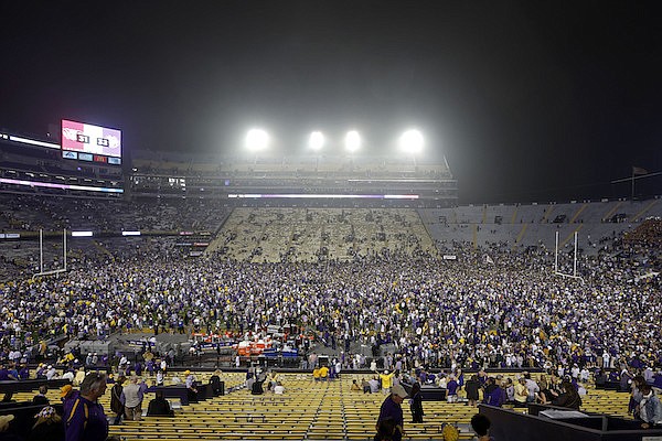 Fans storm the field after an NCAA college football game between LSU and Alabama in Baton Rouge, La., Saturday, Nov. 5, 2022. (AP Photo/Tyler Kaufman)