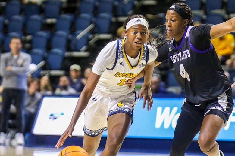 Staff photo by Olivia Ross  / UTC's Yazz Wazeerud-Din (13) heads toward the basket, guarded by Young Harris's Kalen Surles (4). The UT Chattanooga Lady Mocs took on Young Harris College on Monday, November 7, 2022.