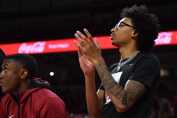 Arkansas guard Nick Smith cheers Monday, Nov. 7, 2022, from the bench during the first half of play against North Dakota State in Bud Walton Arena in Fayetteville.
