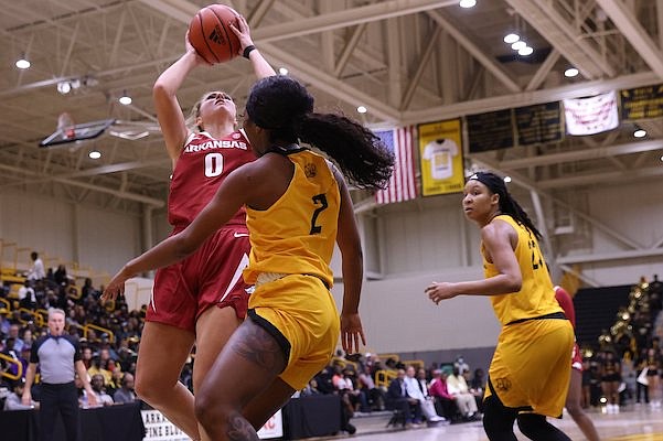 Saylor Poffenbarger (0) puts up a shot for the Razorbacks during a game against UAPB at the H.O. Clemmons Arena in Pine Bluff on Monday, Nov. 7, 2022.
