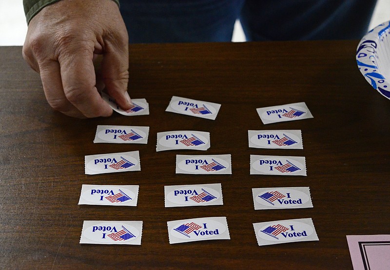 Eileen Wisniowicz/News Tribune photo: 
A poll worker straightens out stickers on Tuesday, Nov. 8, 2022, at the Missouri Electric Co-Op Employee's Credit Union in Jefferson City.