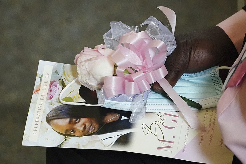 FILE - Marvin Grier holds a program during a funeral service for his daughter Brianna Grier on Aug. 11, 2022, in Atlanta. Prosecutors will not seek an indictment against sheriff's deputies in the death of Grier, a handcuffed Georgia woman who fell from a patrol car after the deputies failed to close the rear passenger-side door, authorities announced Monday, Nov. 7. (AP Photo/John Bazemore, File)