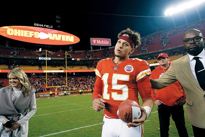 Chiefs quarterback Patrick Mahomes heads off the field following Sunday night’s 20-17 win in overtime against the Titans at Arrowhead Stadium in Kansas City. (Associated Press)