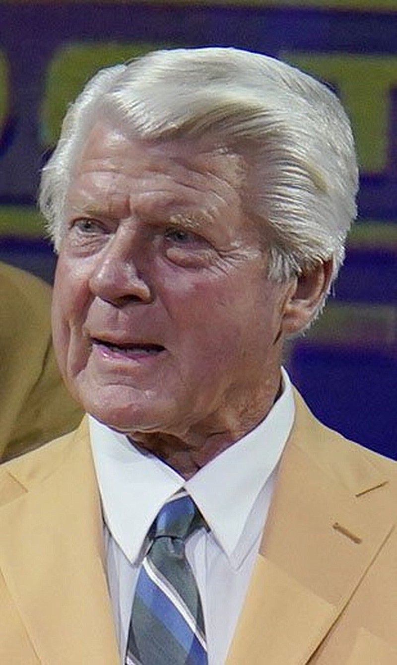 Jimmy Johnson, a member of the Pro Football Hall of Fame Centennial Class, receives his gold jacket during the gold jacket dinner in Canton, Ohio, Friday, Aug. 6, 2021. (AP Photo/Gene J. Puskar)
