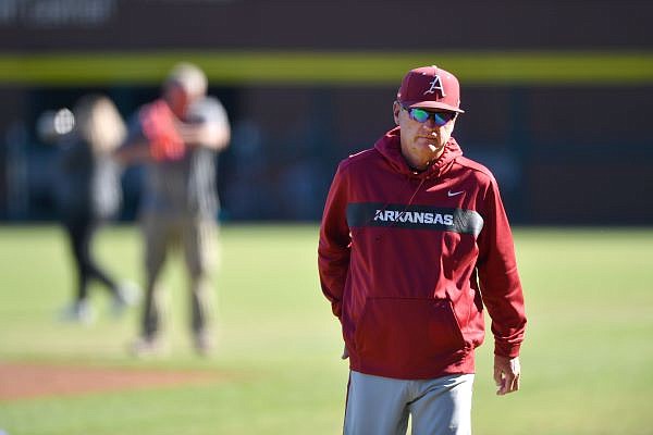 Arkansas coach Dave Van Horn walks back to the dugout Thursday, Oct. 13, 2022, before the start of play against the Texas Rangers Instructional League team at Baum-Walker Stadium in Fayetteville. Visit nwaonline.com/221014Daily/ for today's photo gallery. ...(NWA Democrat-Gazette/Andy Shupe)