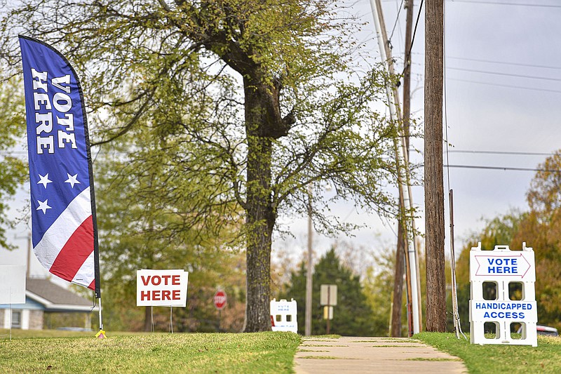 Signs guide voters inside to vote, Tuesday, Nov. 8, 2022, at the Elm Grove Community Center in Fort Smith. (NWA Democrat-Gazette/Hank Layton)