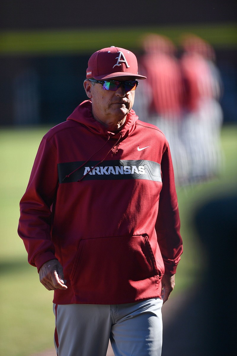 Arkansas Coach Dave Van Horn walks back to the dugout before the Razorbacks’ game against the Texas Rangers Instructional League team Oct. 13 at Baum-Walker Stadium in Fayetteville. Van Horn, who’s entering his 21st-year as Arkansas’ head coach, applauded his staff for the work they’ve put together on the recruiting trail. Arkansas has 23 high school seniors committed, including 12 who are ranked among the top 90 recruits nationally by Perfect Game.
(NWA Democrat-Gazette/Andy Shupe)