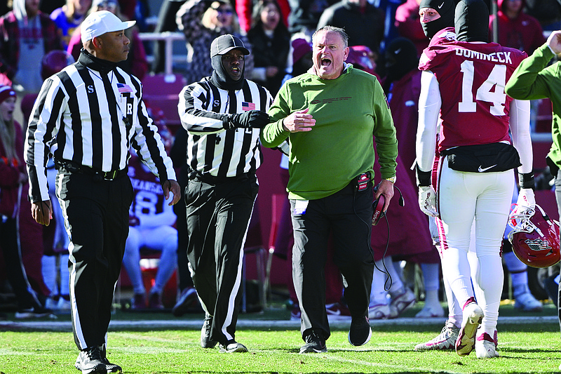Arkansas coach Sam Pittman reacts to the officials call after a replay review against LSU during the second half of an NCAA college football game Saturday in Fayetteville.