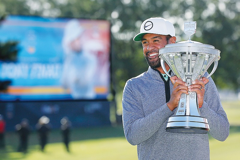 Tony Finau holds the trophy Sunday after winning the Houston Open in Houston. (Associated Press)
