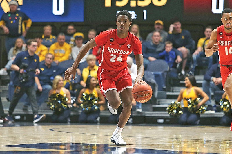 Artese Stapleton dribbles up court for Radford during a game last season against West Virginia in Morgantown, W.Va. Stapleton is a transfer guard for Lincoln this season. (Associated Press)