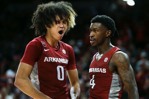 Arkansas guard Anthony Black (0) and guard Davonte Davis (4) react, Friday, November 11, 2022 during the first half of a basketball game at Bud Walton Arena in Fayetteville. Visit nwaonline.com/221112Daily/ for the photo gallery.