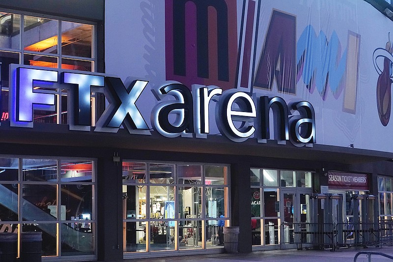 A sign for the FTX Arena, where the Miami Heat basketball team plays, is illuminated on Nov. 12, 2022, in Miami. FTX filed for bankruptcy protection Friday, Nov. 11. (AP Photo/Marta Lavandier, File)