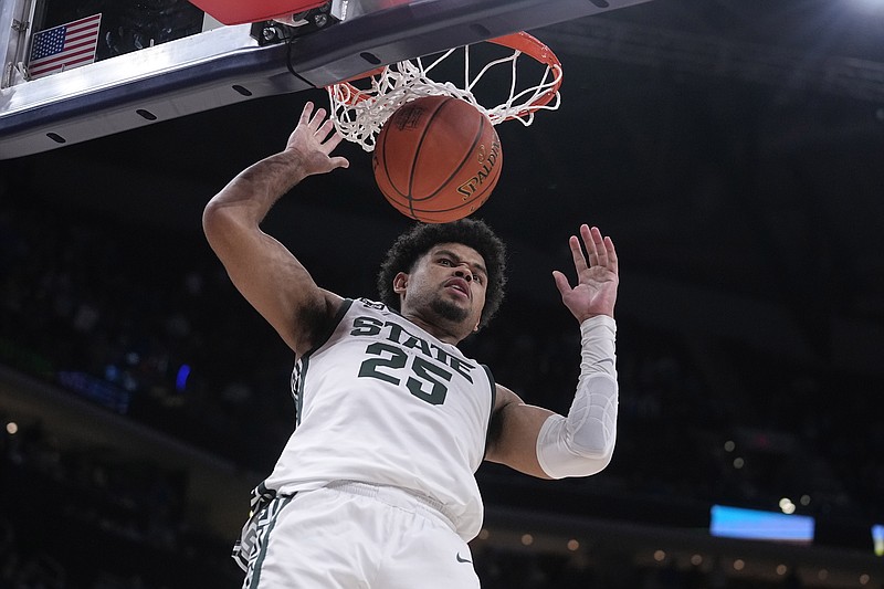 Michigan State forward Malik Hall (25) scores against Kentucky during the second half of an NCAA college basketball game, Tuesday, Nov. 15, 2022, in Indianapolis. (AP Photo/Darron Cummings)
