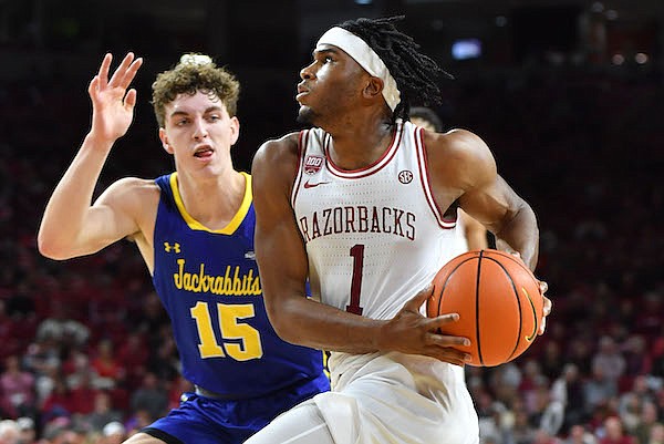Arkansas guard Ricky Council (1) drives to the basket Wednesday, Nov. 16, 2022, past South Dakota State guard Tanner Te Slaa (15) during the second half of the Razorbacks' 71-56 win in Bud Walton Arena in Fayetteville.