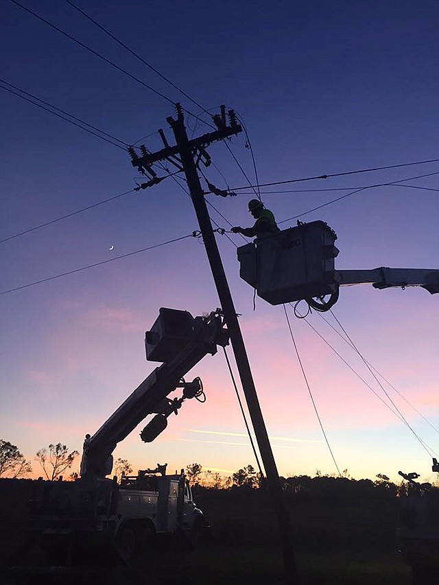This undated file photo shows a Three Rivers Electric Cooperative lineman working on power lines.