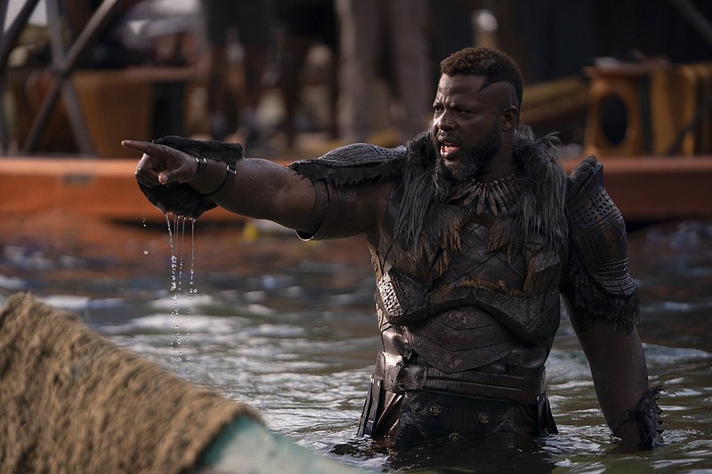 Winston Duke — as M’Baku — rises from the water in a dramatic moment from “Black Panther: Wakanda Forever.” The sequel made $180 million at U.S. and Canadian theaters last week.