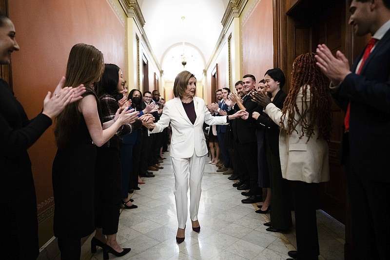 Staff members applaud House Speaker Nancy Pelosi after she announced Thursday that she would step down from her leadership position.
(The New York Times/Erin Schaff)